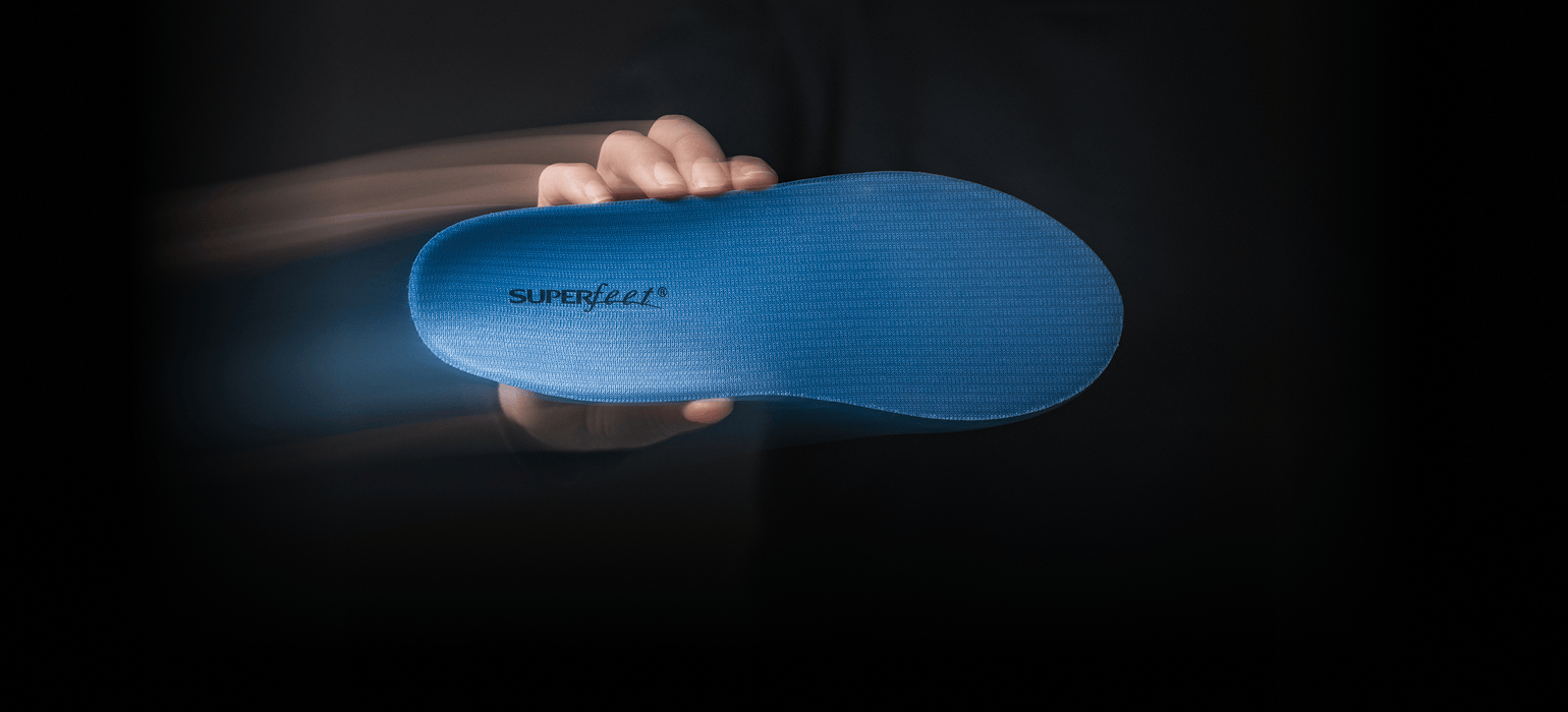 Gif of people holding different green, blue, and black all-purpose Superfeet insoles.