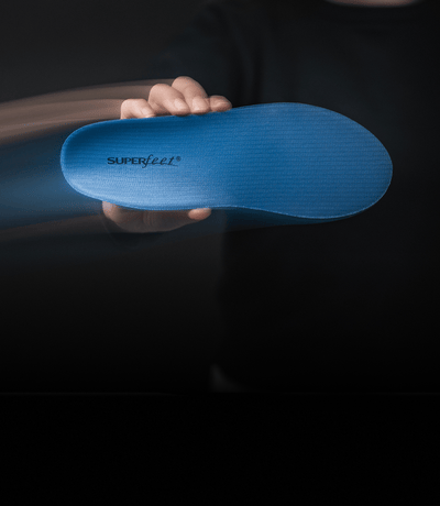 Gif of people holding different green, blue, and black all-purpose Superfeet insoles.