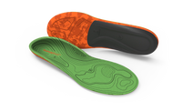 Green and orange shoe insoles on a light gray background
