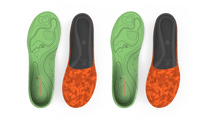 Two pairs of green and orange shoe insoles on a light gray background